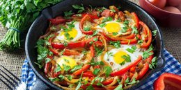 Baked Eggs Skillet With Red Peppers and Onions