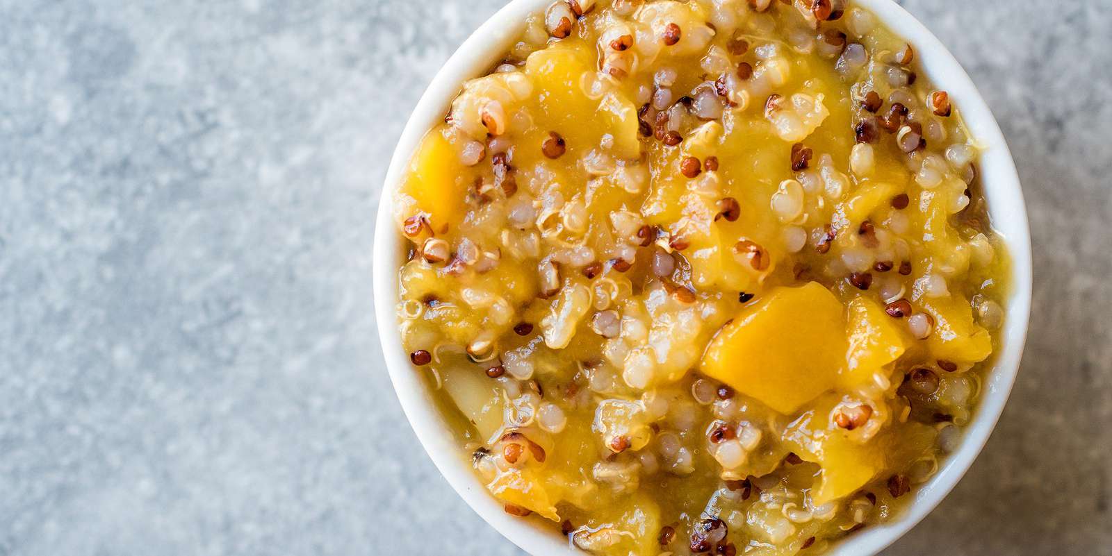 Quinoa Breakfast Bowl with Mango and Walnuts